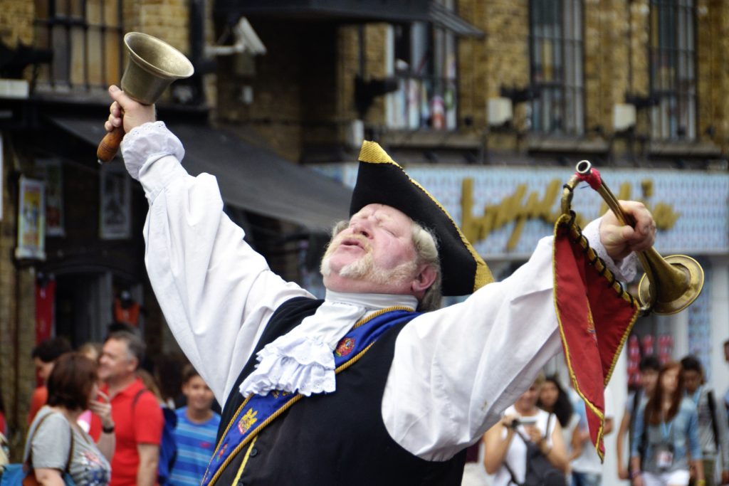 Costumed town crier at work